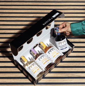 A box of mini bottles of Belle Isle moonshine