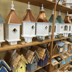 copper roof bird houses in a line