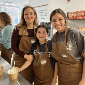 A mother and daughters take an icecream workshop 