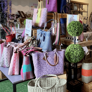 a display of colorful bags