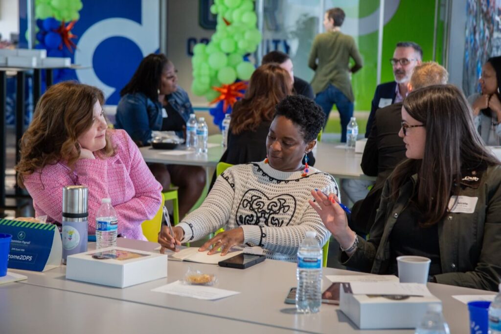 Local business owners talking together at an InUnison community gathering